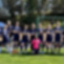 This photo links to the Saint Nicholas Catholic School Athletics and Sports page, and depicts the 7th and 8th grade girls' soccer team in the school soccer field in Los Altos, California.