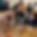 This photo links to the Saint Nicholas Catholic School in-school connections page. It depicts 8th graders with their buddy in transitional-kindergarten at their pie and cider feast celebrating Thanksgiving.